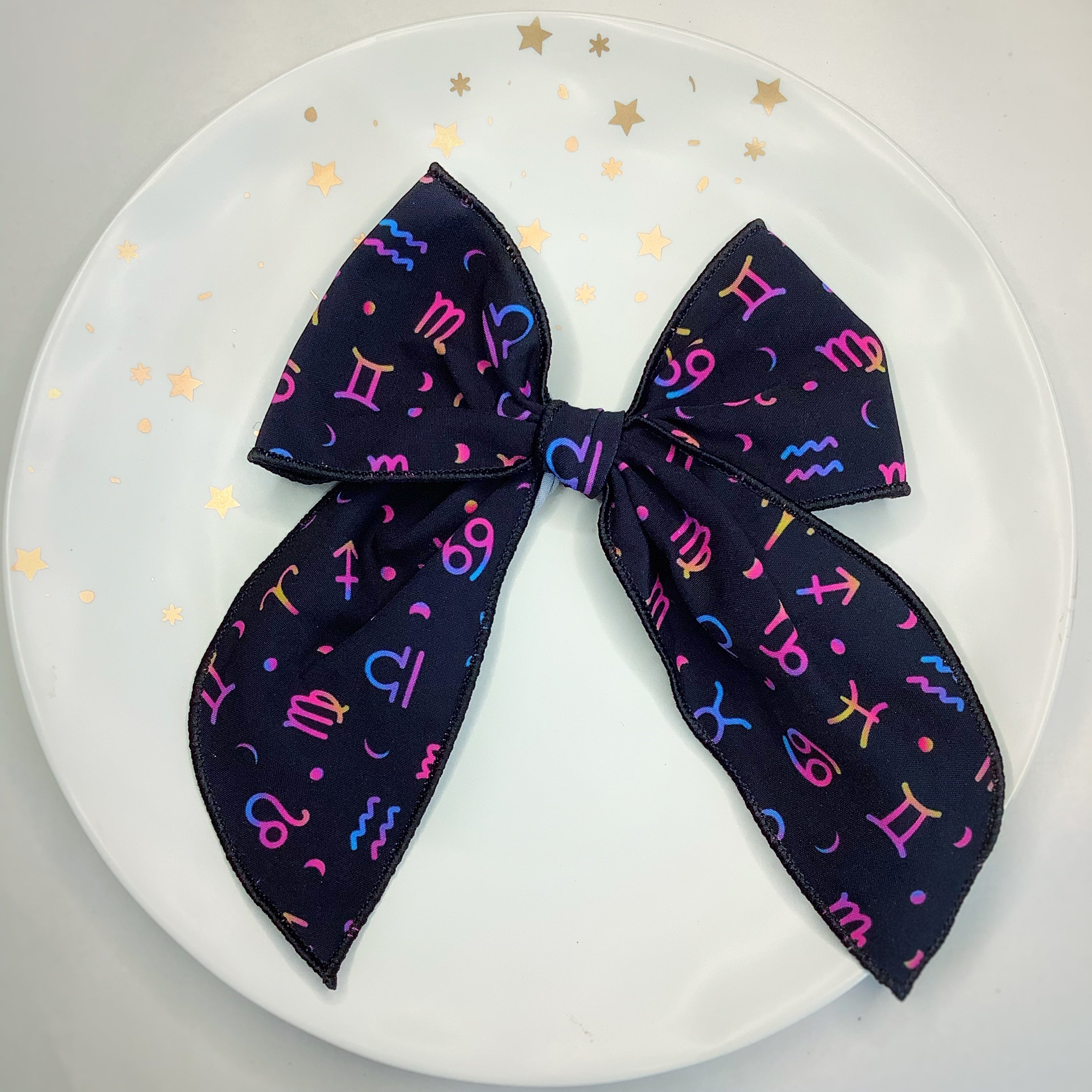 The Zodiac Bow Strip and Scrunchie Collection