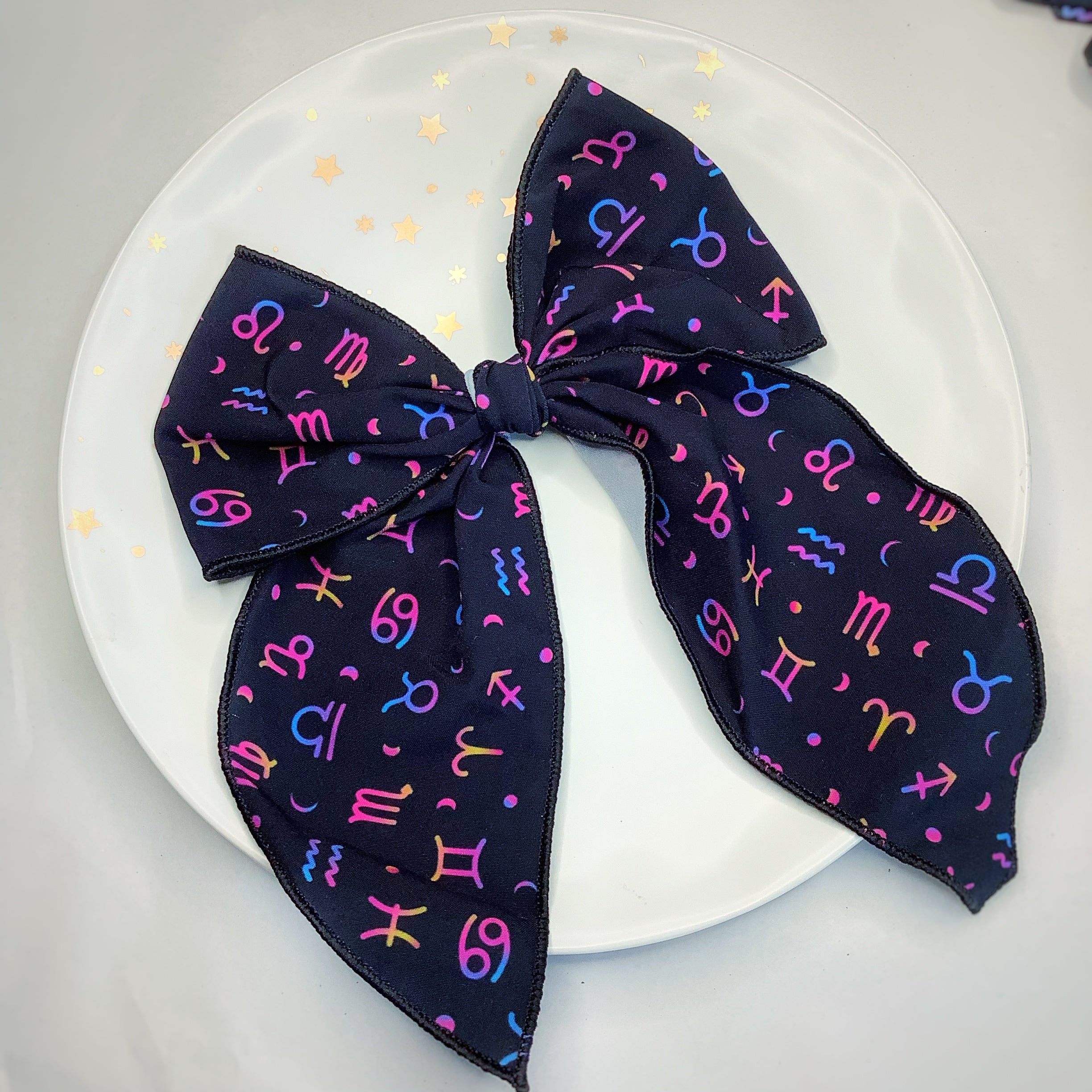 The Zodiac Bow Strip and Scrunchie Collection