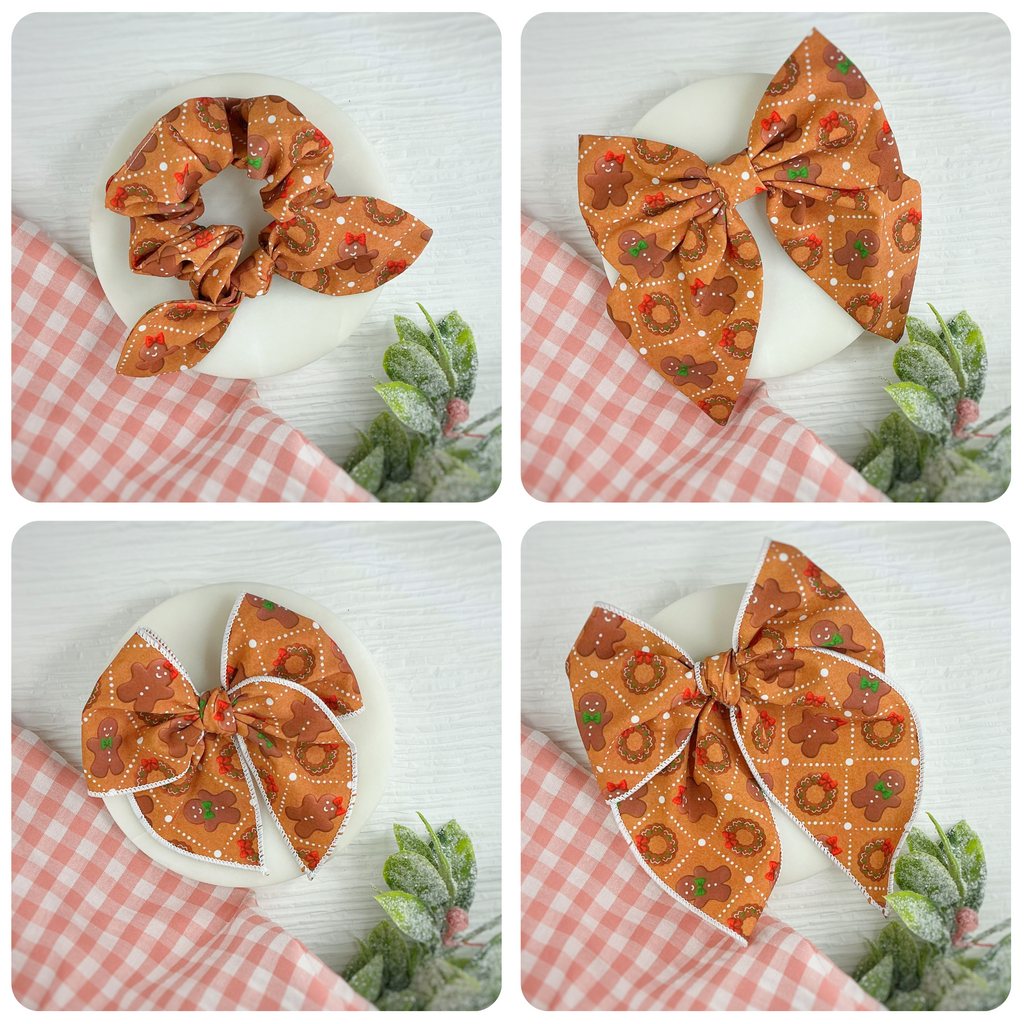 A four-panel collage showing a fabric hair accessory set: an orange scrunchie and two large bows, each printed with a white dotted grid and circular floral motifs in orange, red, and green. The accessories are displayed on white plates with pink gingham cloth and small succulent plants.